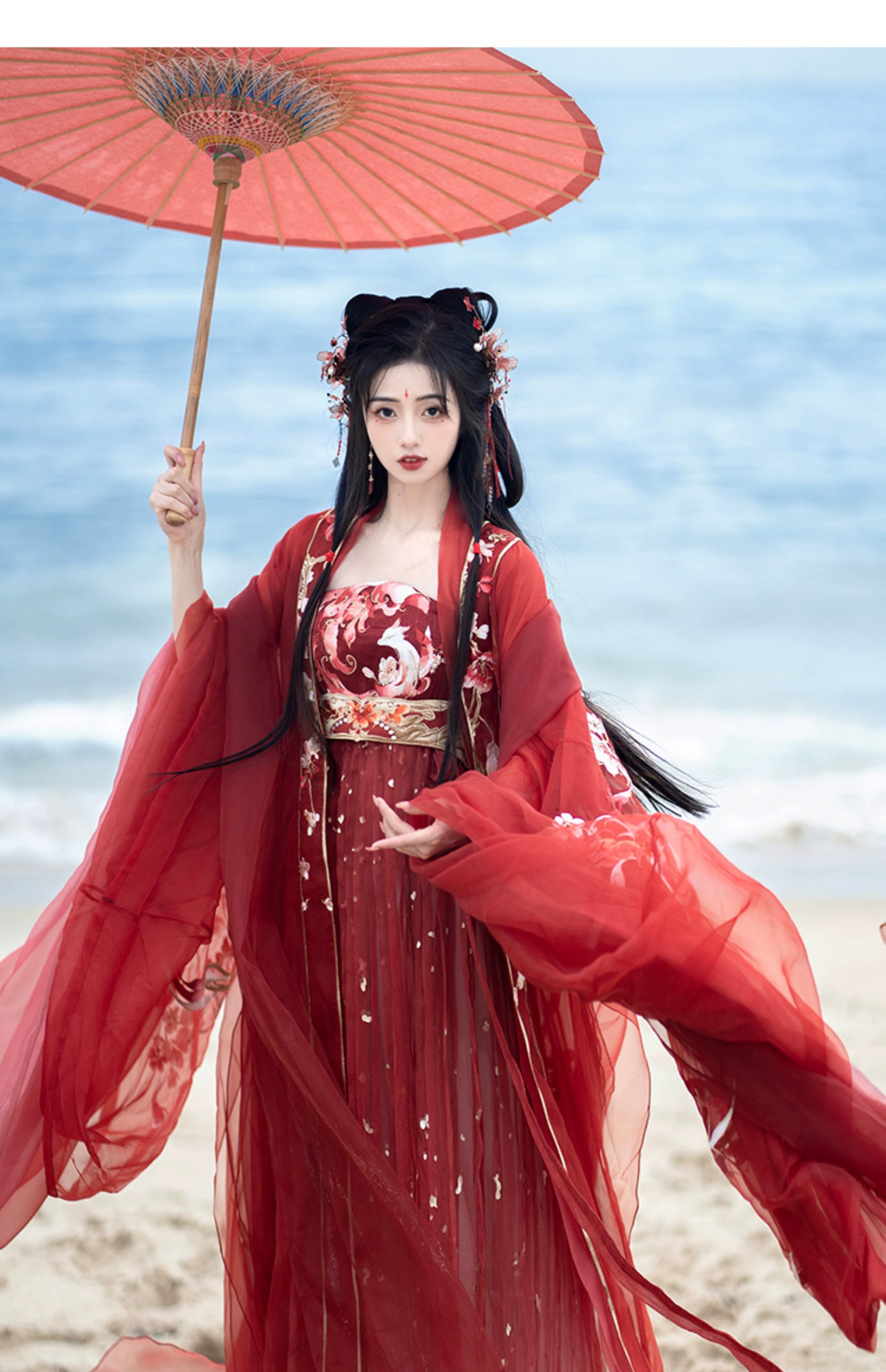 Step into the opulent world of Tang Dynasty elegance with our exquisite Red Hanfu Ensemble. Featuring a chest-length wrap skirt adorned with intricate super fairy embroidery and paired with a flowing large-sleeved top suit, our ensemble captures the essence of Tang Dynasty grandeur and sophistication. Embrace the rich heritage and timeless beauty of ancient Chinese fashion with our stunning collection.