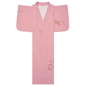 Flat-lay of a pink Japanese kimono yukata with floral patterns, highlighting its elegant design and traditional craftsmanship.