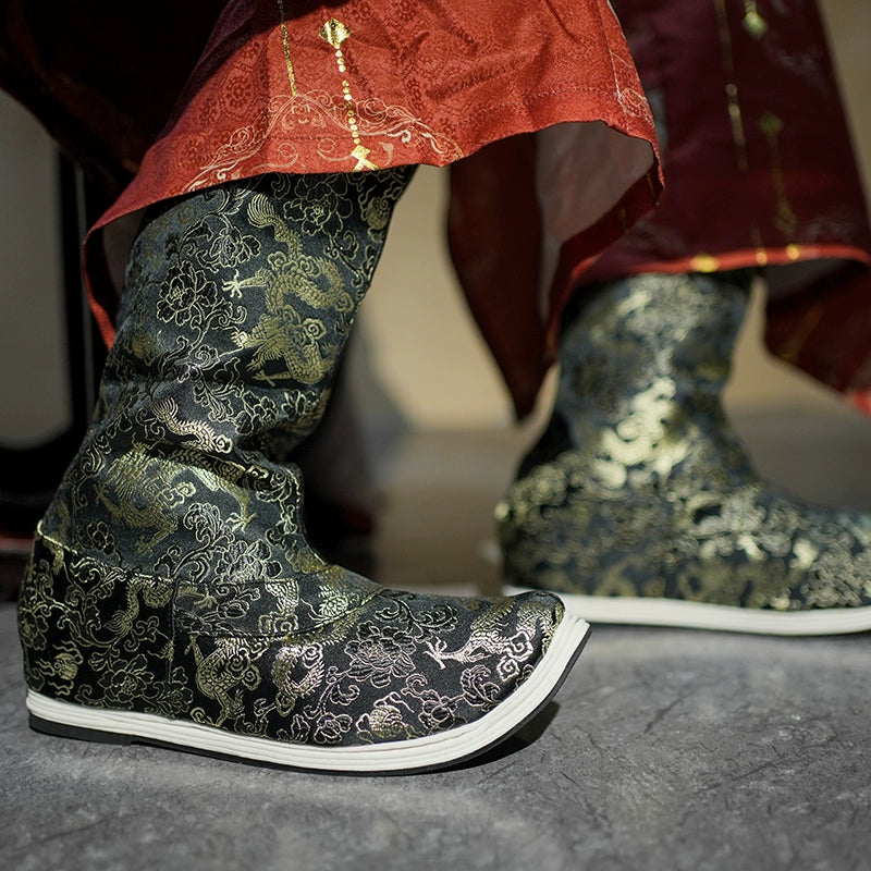 Intricately embroidered Dragon boots in black and gold, styled with a red Hanfu robe, showcasing traditional Ming-dynasty craftsmanship.