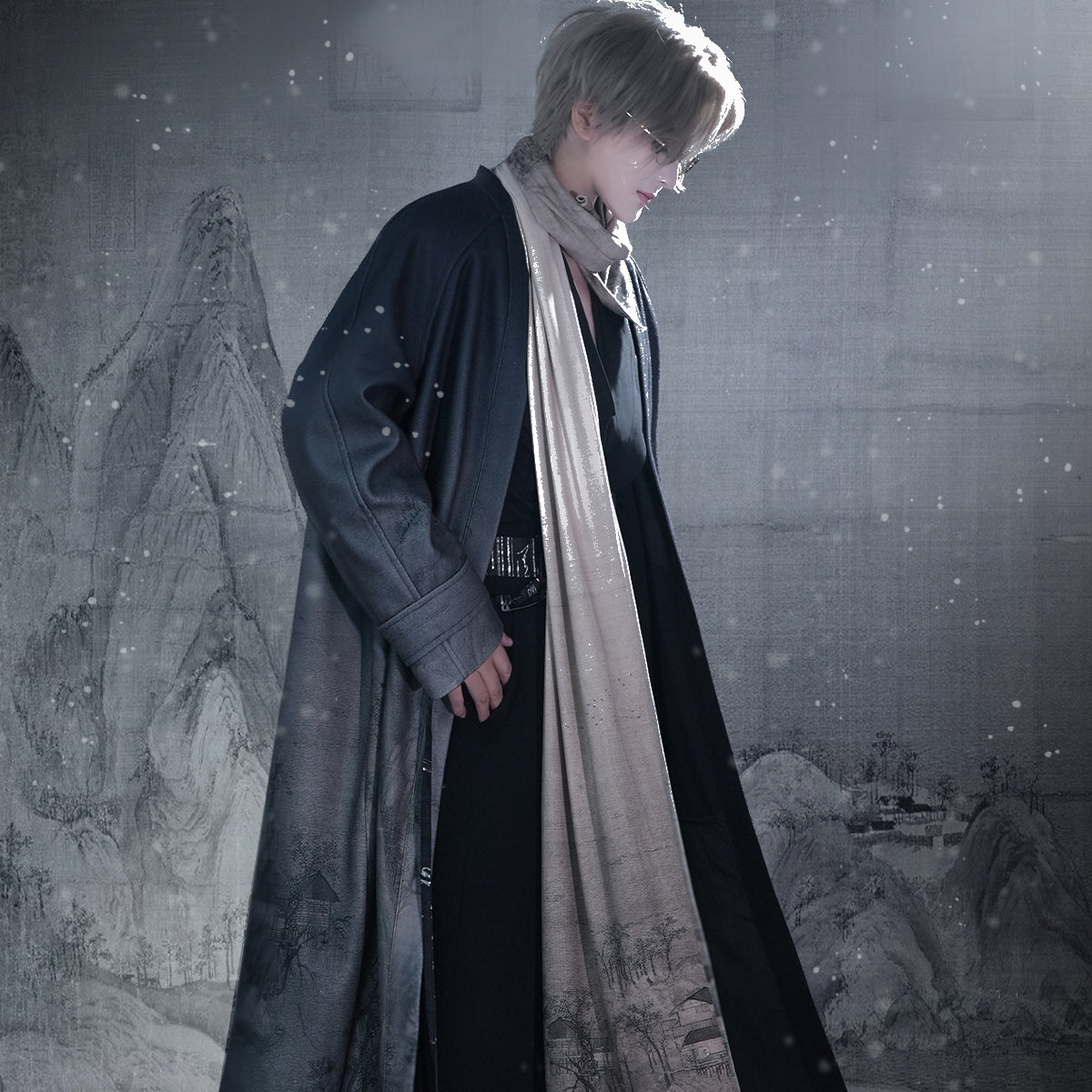 Person in a long coat and scarf standing in a snowy landscape with a mural in the background