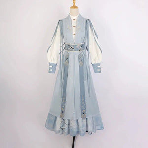 Blue hanfu dress for women, blending traditional Song Dynasty and modern Chinese styles, crafted from luxurious silk. This versatile hanfu includes options for a matching coat or jacket, making it suitable for winter wear, Chinese New Year celebrations, or casual outings. Ideal for occasions like graduations or cosplay, this dress embodies the fairy-inspired elegance of classic hanfu while also drawing from martial arts clothing and contemporary Chinese fashion. Available for purchase in our online hanfu sh