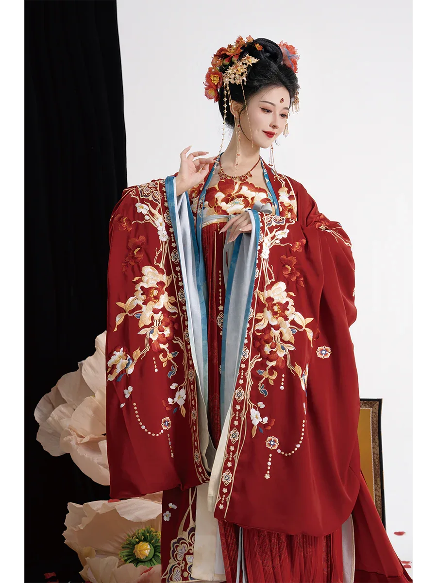 Traditional authentic tang style bridal hanfu custom embroidered red gown with grand flowing sleeves for bride standing front
