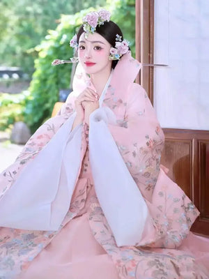 Traditional pink korean court dress for women royal palace hanbok for formal occasions and celebrations standing front