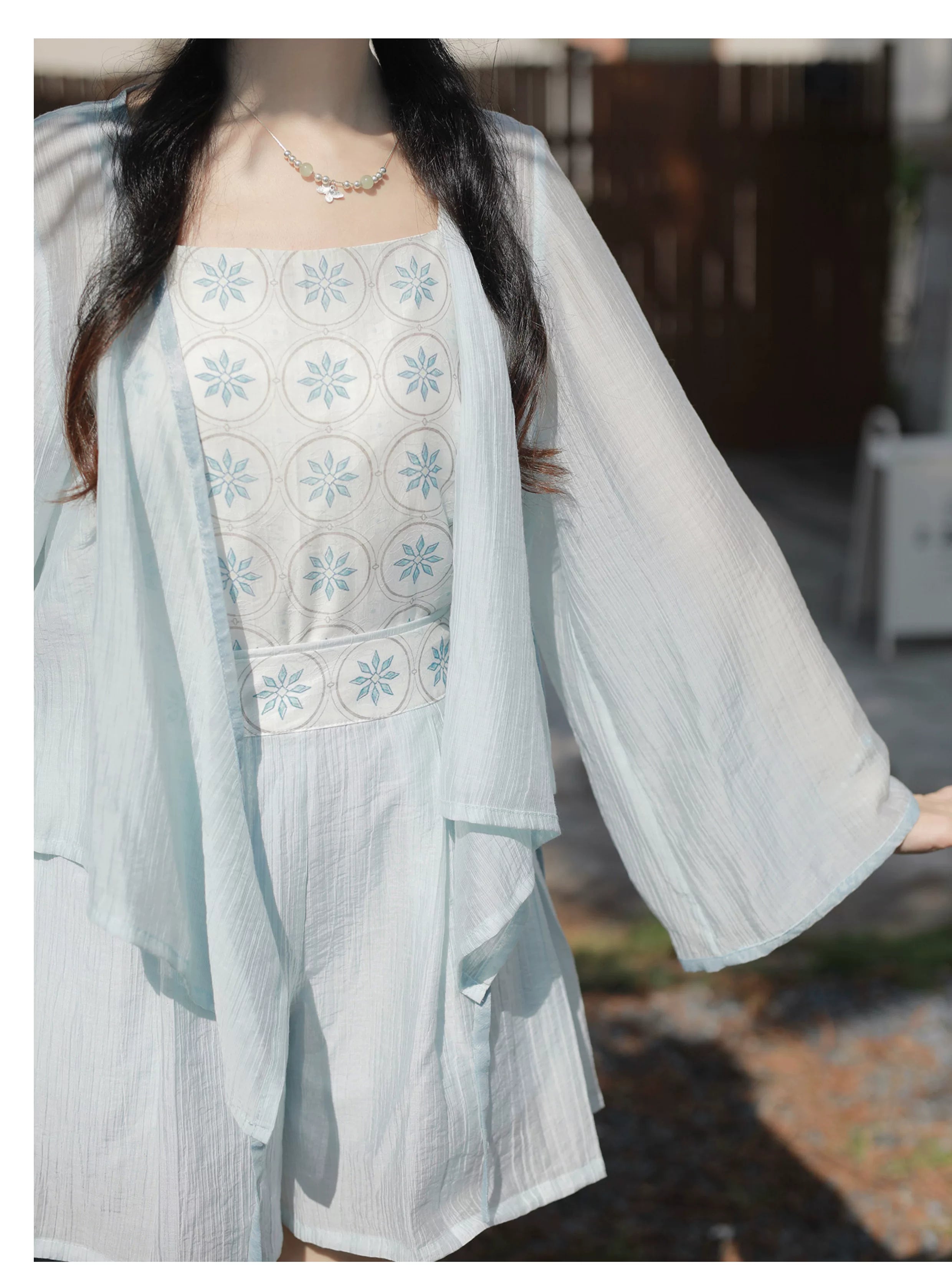 Xiaolu water blue small flower brick summer set cross neck tencel bud shorts with pockets and long sleeve for sun protection fabric detail