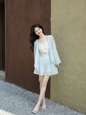  Xiaolu water women summer daily outfit cross neck tencel blouse with small flower print and bud shorts pocket in blue back view