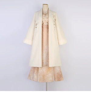 Apricot modern Hanfu coat, floral blouse and long skirt displayed together on a mannequin