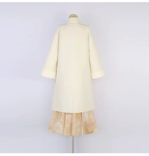 Back view of the apricot Hanfu coat and long skirt on a mannequin