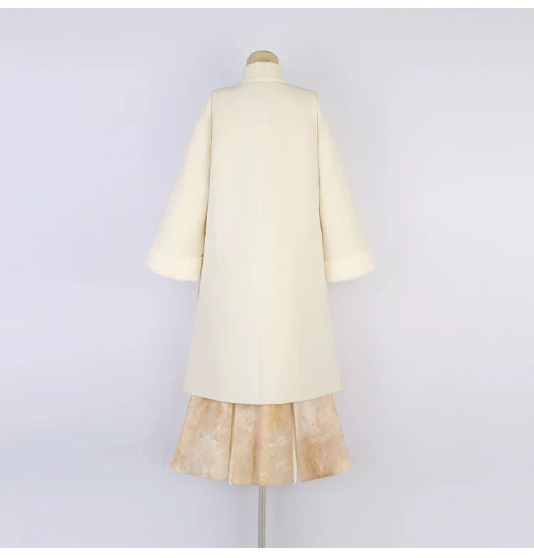 Back view of the apricot Hanfu coat and long skirt on a mannequin