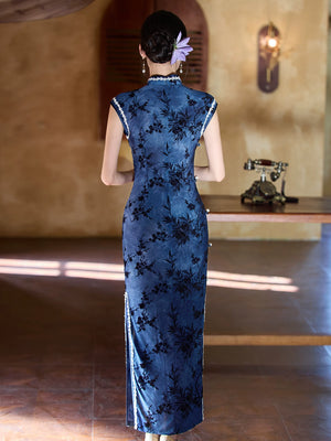 Back view of the blue bamboo sleeveless cheongsam showing the fitted waist and long skirt