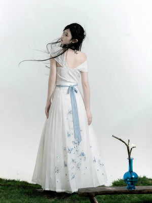 Back view of the white butterfly Hanfu separates showing a blue waist tie and embroidery on the skirt panel