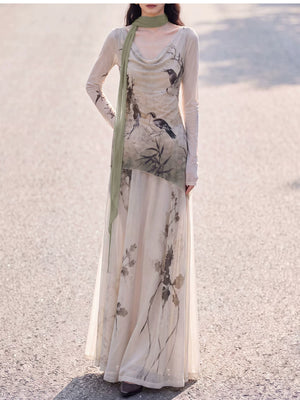 Beige cowl-neck knit top and skirt with hand on hip