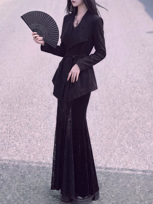 Black belted Chinese jacket styled with a folding fan
