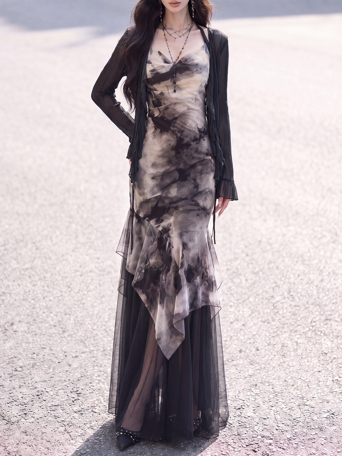 Black chiffon cardigan layered over ink print fishtail dress
