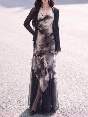 Black chiffon cardigan layered over ink print fishtail dress