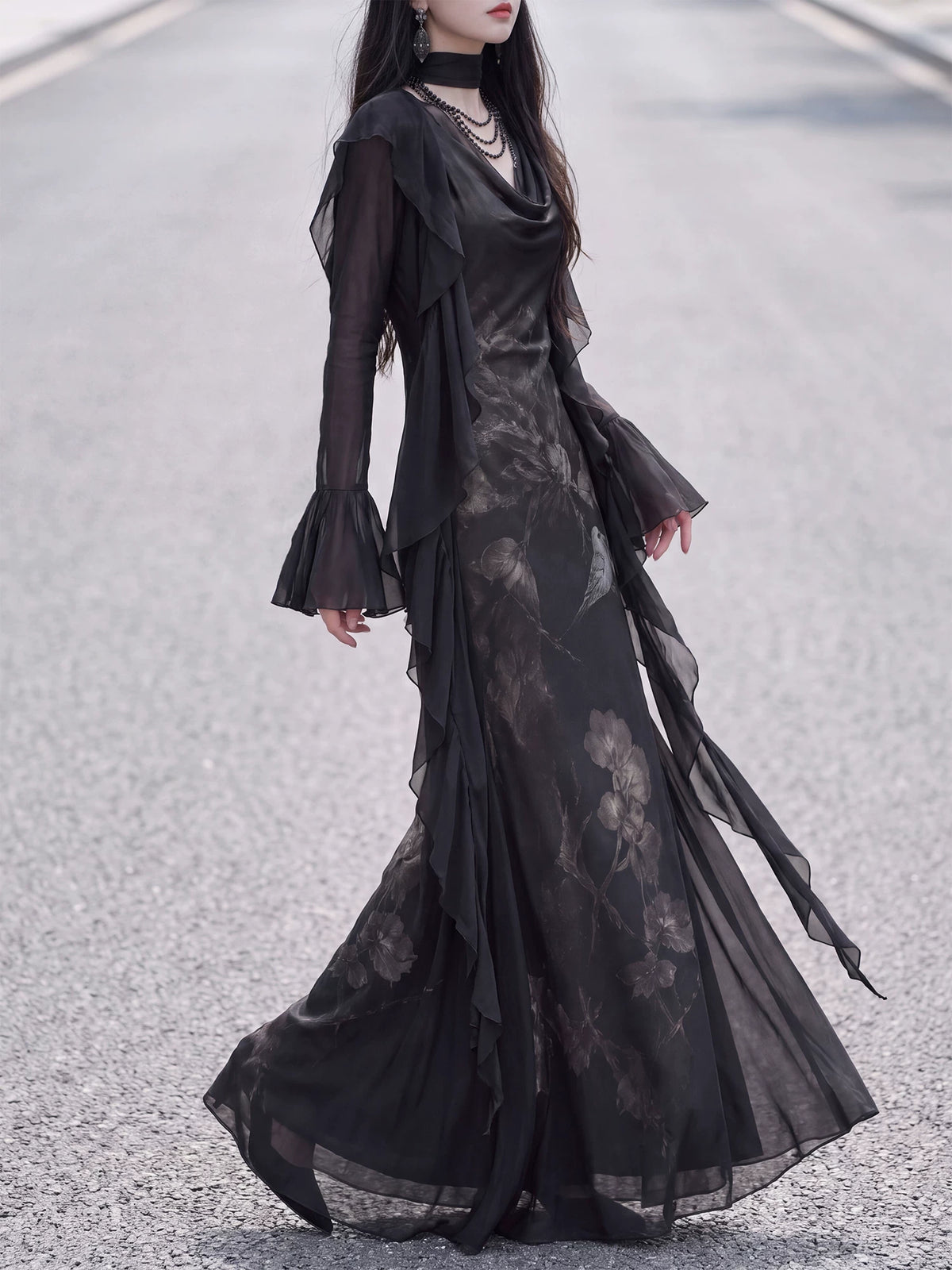 Black chiffon ruffle cardigan and floral dress in motion