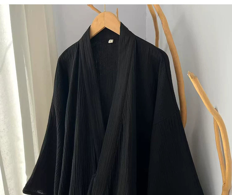 Crossover collar construction on the solid black cotton gauze robe