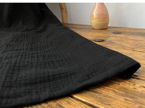 Close-up of naturally crinkled two-layer pure cotton gauze fabric