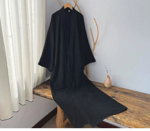 Black two-layer cotton gauze robe hanging to show its relaxed unisex shape