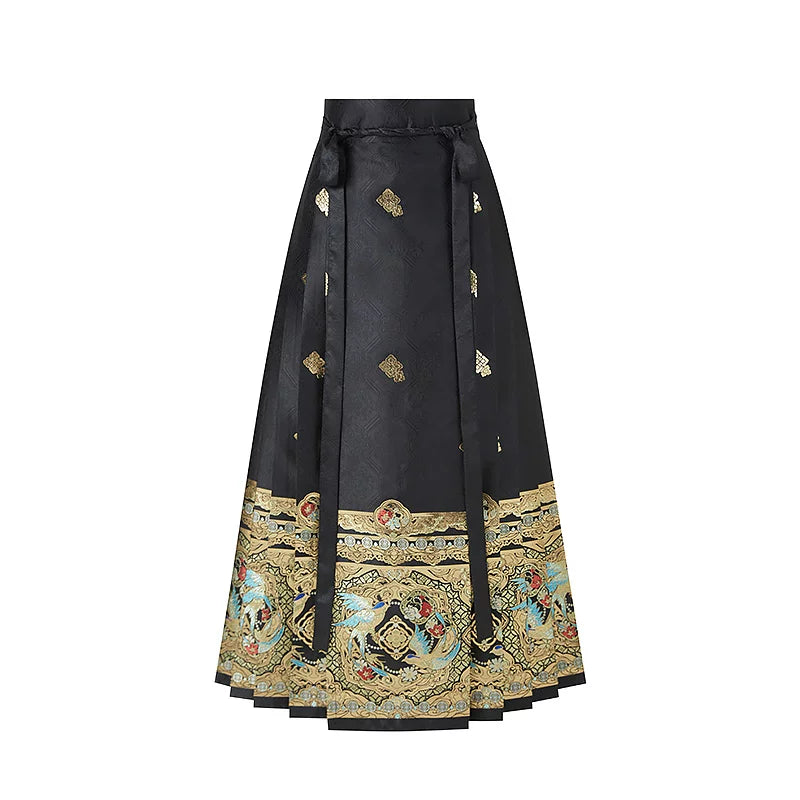 Black magpie mamian skirt with small woven motifs, waist ties and a wide gold-tone border