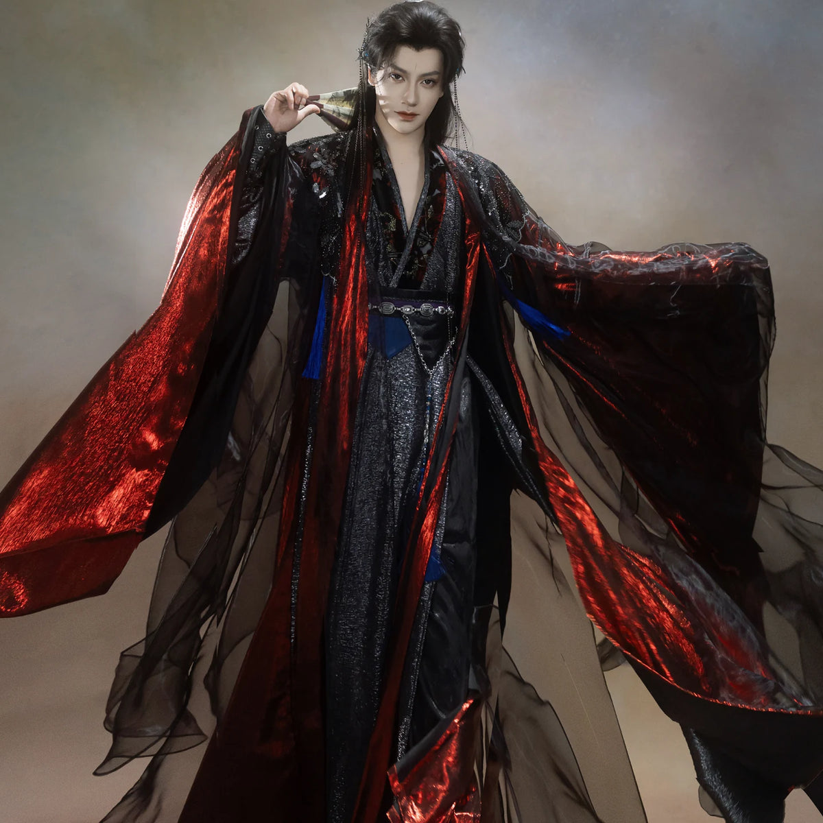 Black and red wuxia Hanfu robes with glossy red lining and sheer black outer layers, sleeves extended