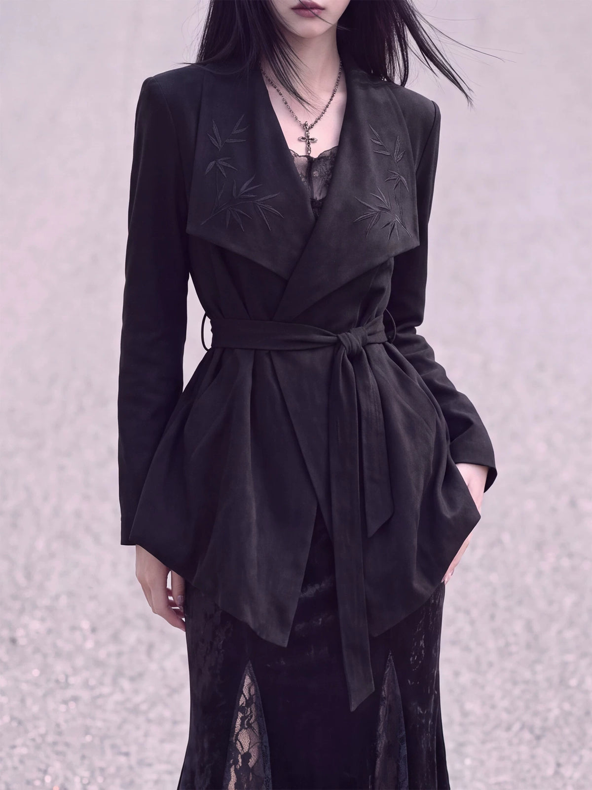 Black suede-effect wrap jacket with bamboo lapels and a waist tie