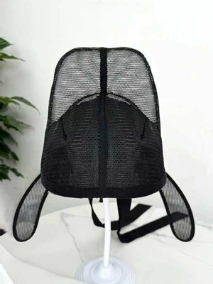Black winged scholar hat displayed on a stand