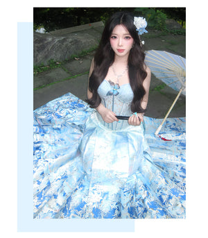 Blue and gold mamian skirt draped in a seated pose
