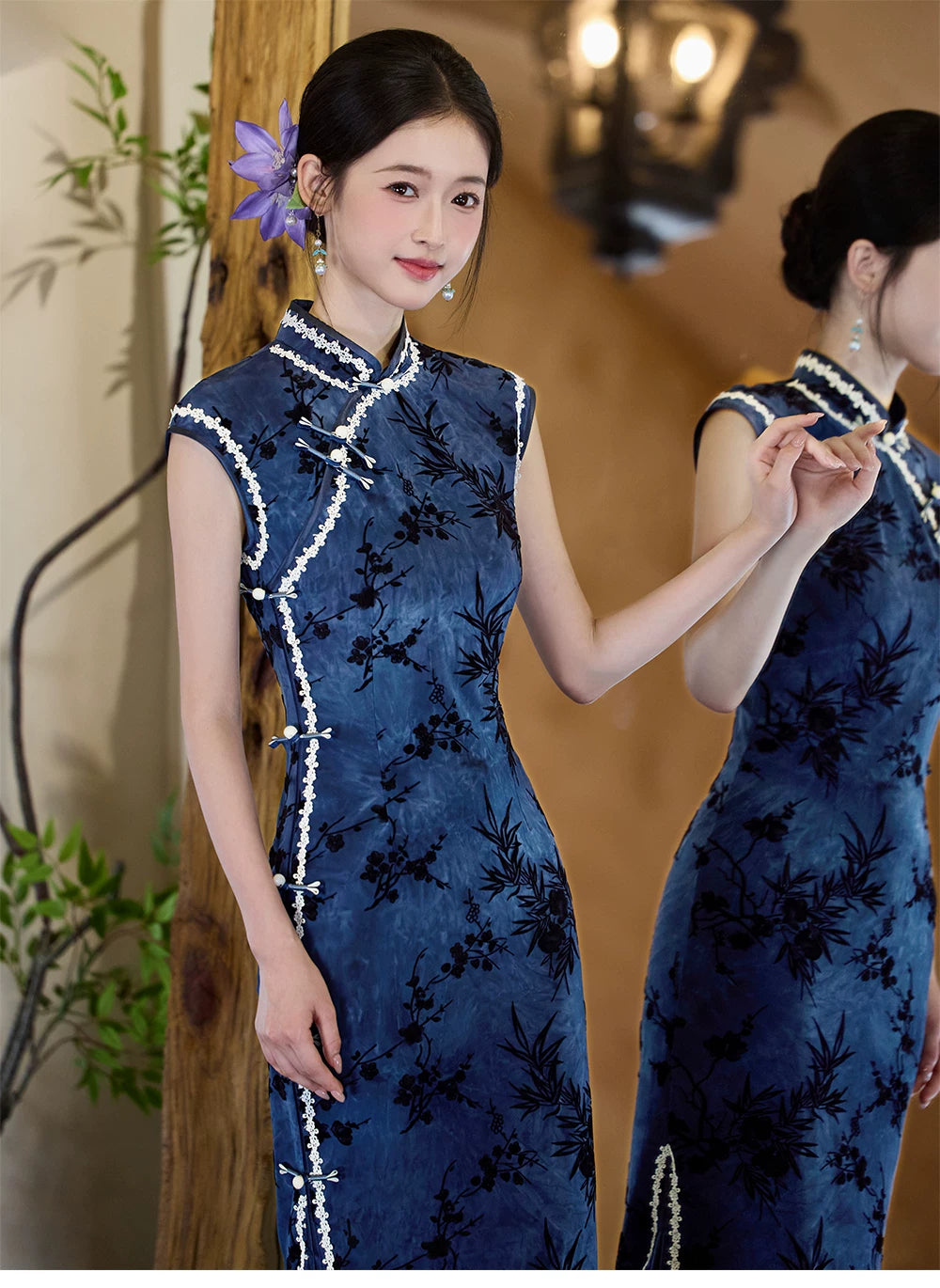 Blue bamboo cheongsam beside a mirror showing the front bodice and reflected back