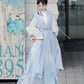 Blue hanfu dress for women, blending traditional Song Dynasty and modern Chinese styles, crafted from luxurious silk. This versatile hanfu includes options for a matching coat or jacket, making it suitable for winter wear, Chinese New Year celebrations, or casual outings. Ideal for occasions like graduations or cosplay, this dress embodies the fairy-inspired elegance of classic hanfu while also drawing from martial arts clothing and contemporary Chinese fashion. Available for purchase in our online hanfu sh