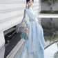 Blue hanfu dress for women, blending traditional Song Dynasty and modern Chinese styles, crafted from luxurious silk. This versatile hanfu includes options for a matching coat or jacket, making it suitable for winter wear, Chinese New Year celebrations, or casual outings. Ideal for occasions like graduations or cosplay, this dress embodies the fairy-inspired elegance of classic hanfu while also drawing from martial arts clothing and contemporary Chinese fashion. Available for purchase in our online hanfu sh