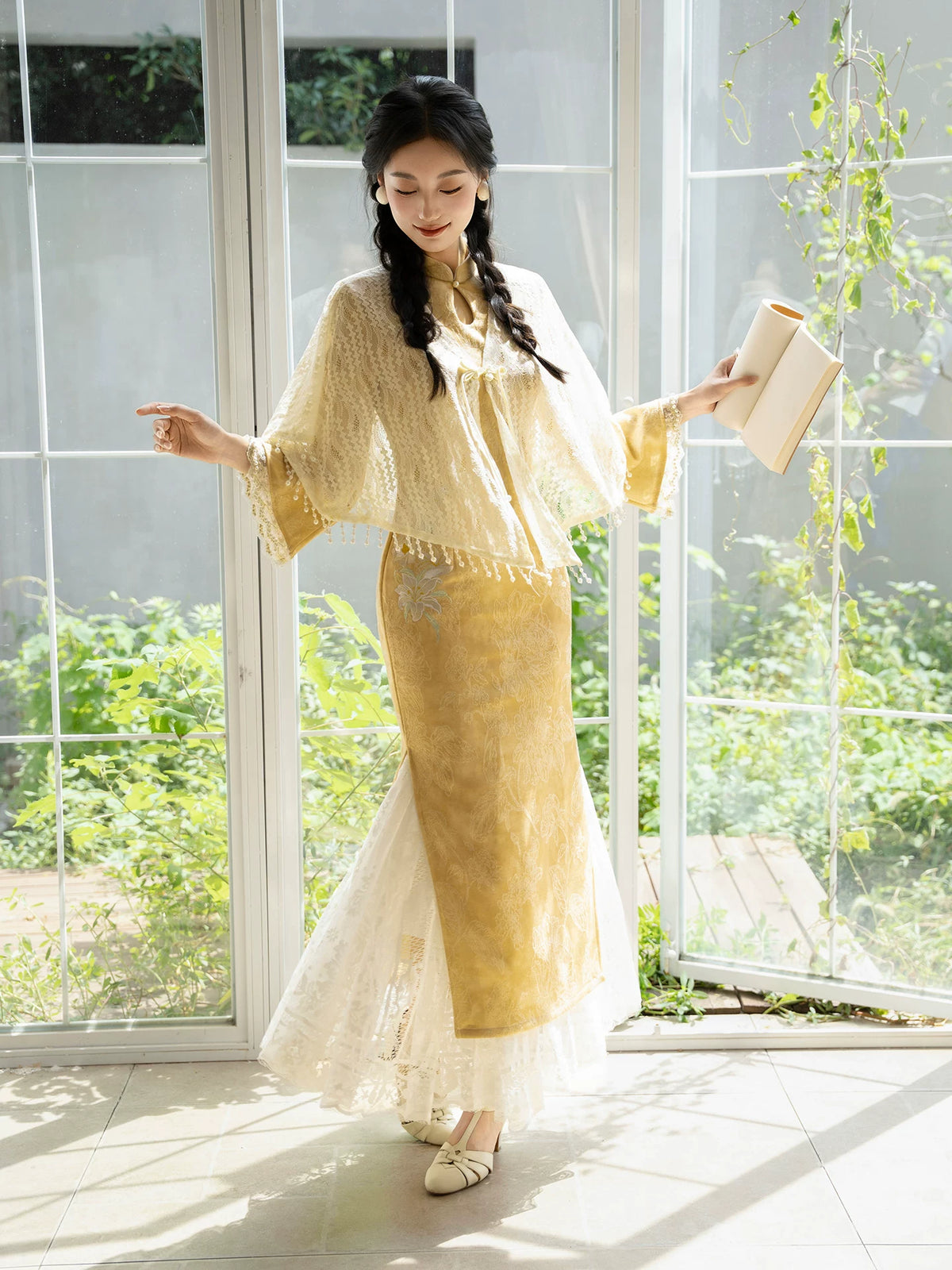 Yellow jacquard qipao styled with an ivory shawl and lace slip