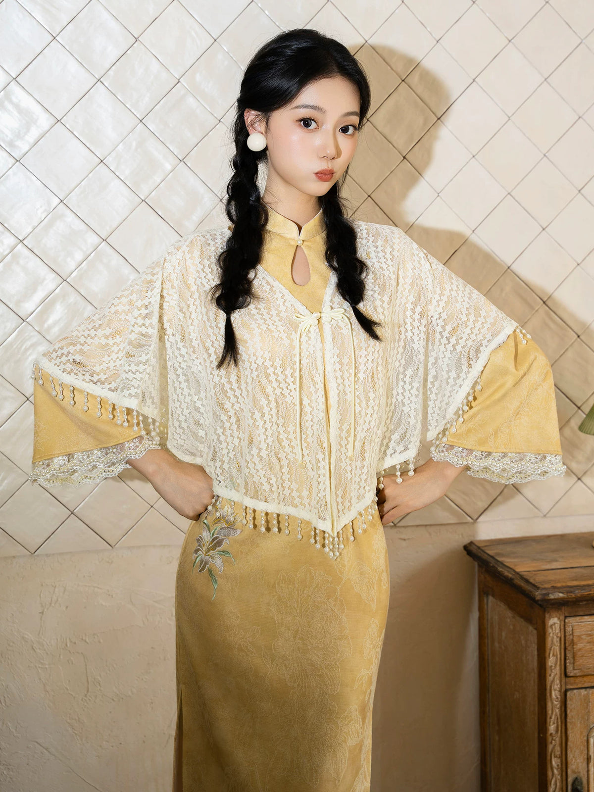 Yellow qipao and ivory fringe shawl