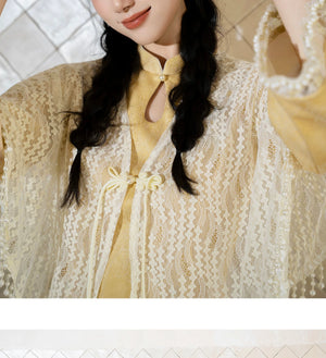 Ivory fringe shawl styled over yellow qipao