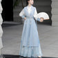 Blue hanfu dress for women, blending traditional Song Dynasty and modern Chinese styles, crafted from luxurious silk. This versatile hanfu includes options for a matching coat or jacket, making it suitable for winter wear, Chinese New Year celebrations, or casual outings. Ideal for occasions like graduations or cosplay, this dress embodies the fairy-inspired elegance of classic hanfu while also drawing from martial arts clothing and contemporary Chinese fashion. Available for purchase in our online hanfu sh