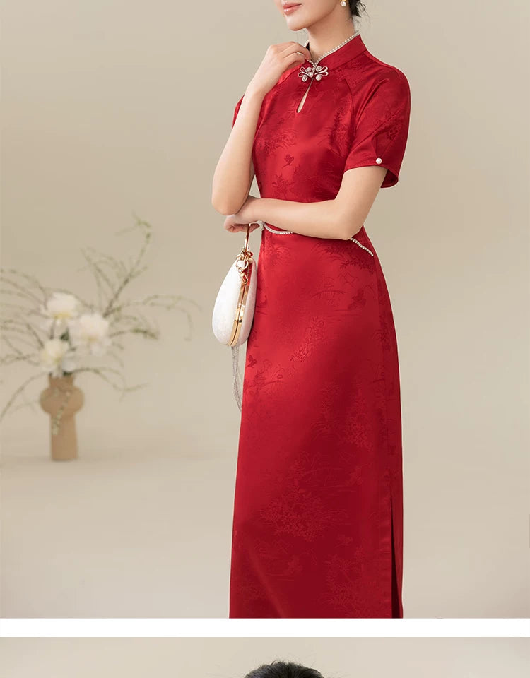 Detailed product image of the Ceremonial Red jacquard engagement qipao dress, showing fabric texture, finish and craftsmanship.