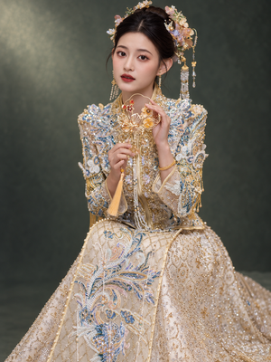 Champagne Xiuhe wedding dress, seated portrait with blue and gold embroidery