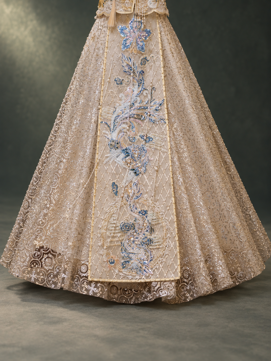 Champagne Xiuhe wedding skirt, blue dragon phoenix motif and decorated hem detail