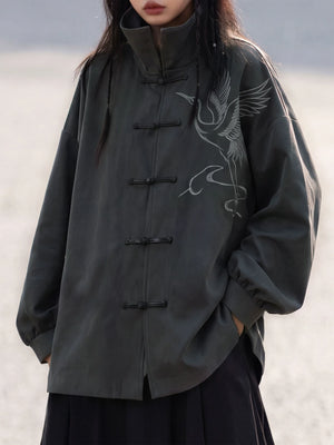 Charcoal Chinese jacket showing a crane motif and frog closures