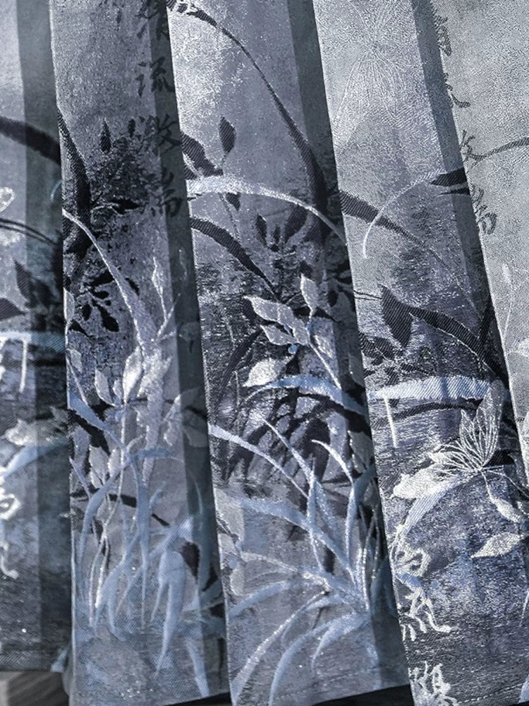 Detailed blue-gray Clivia pattern across the mamian skirt pleats with white floral accents.
