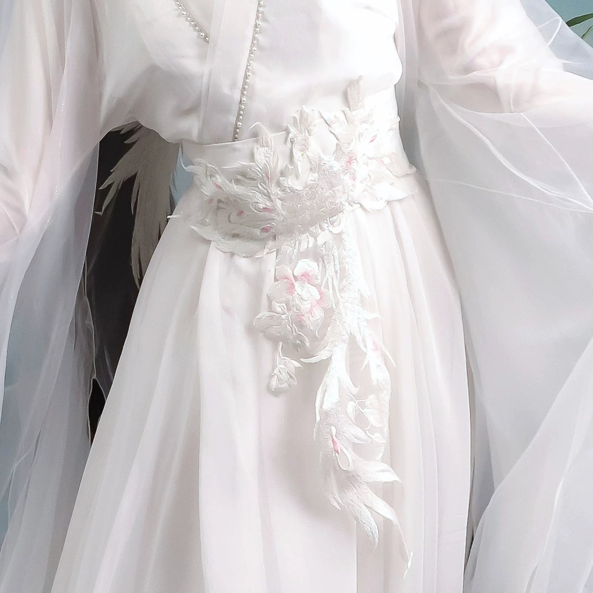 Close-up of the white decorative waist sash