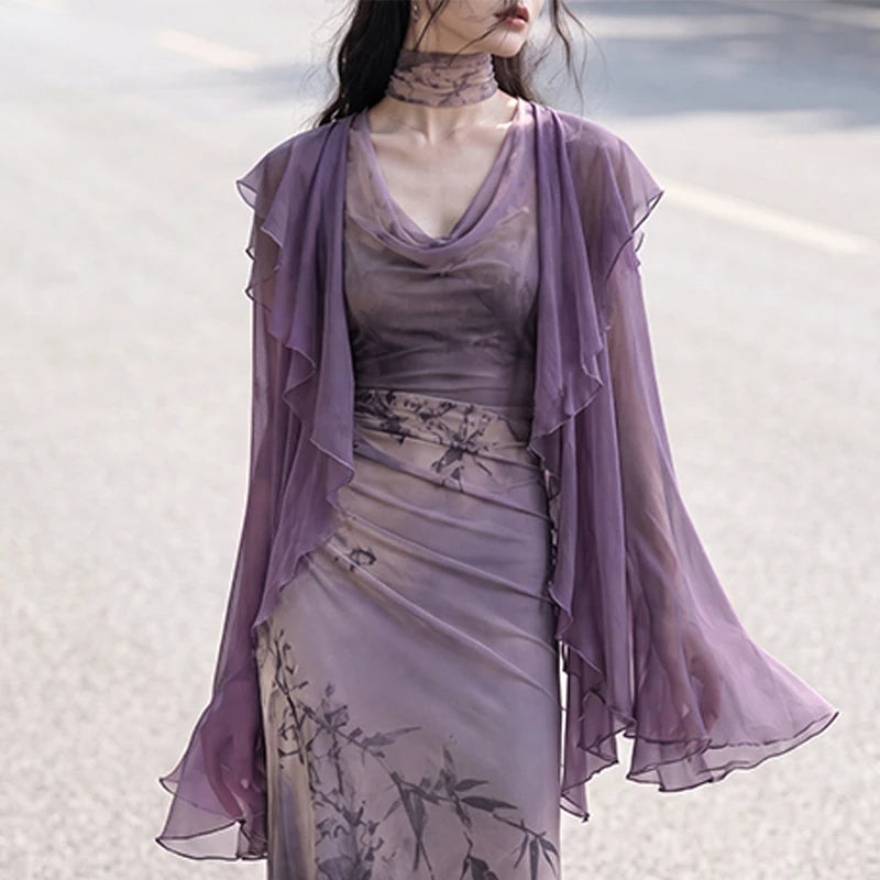 Close view of the purple chiffon cardigan and draped dress neckline