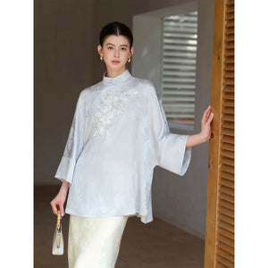 Silhouette and fit view of the Cloud-Mist Blue embroidered satin top and skirt, a contemporary New Chinese Style outfit.