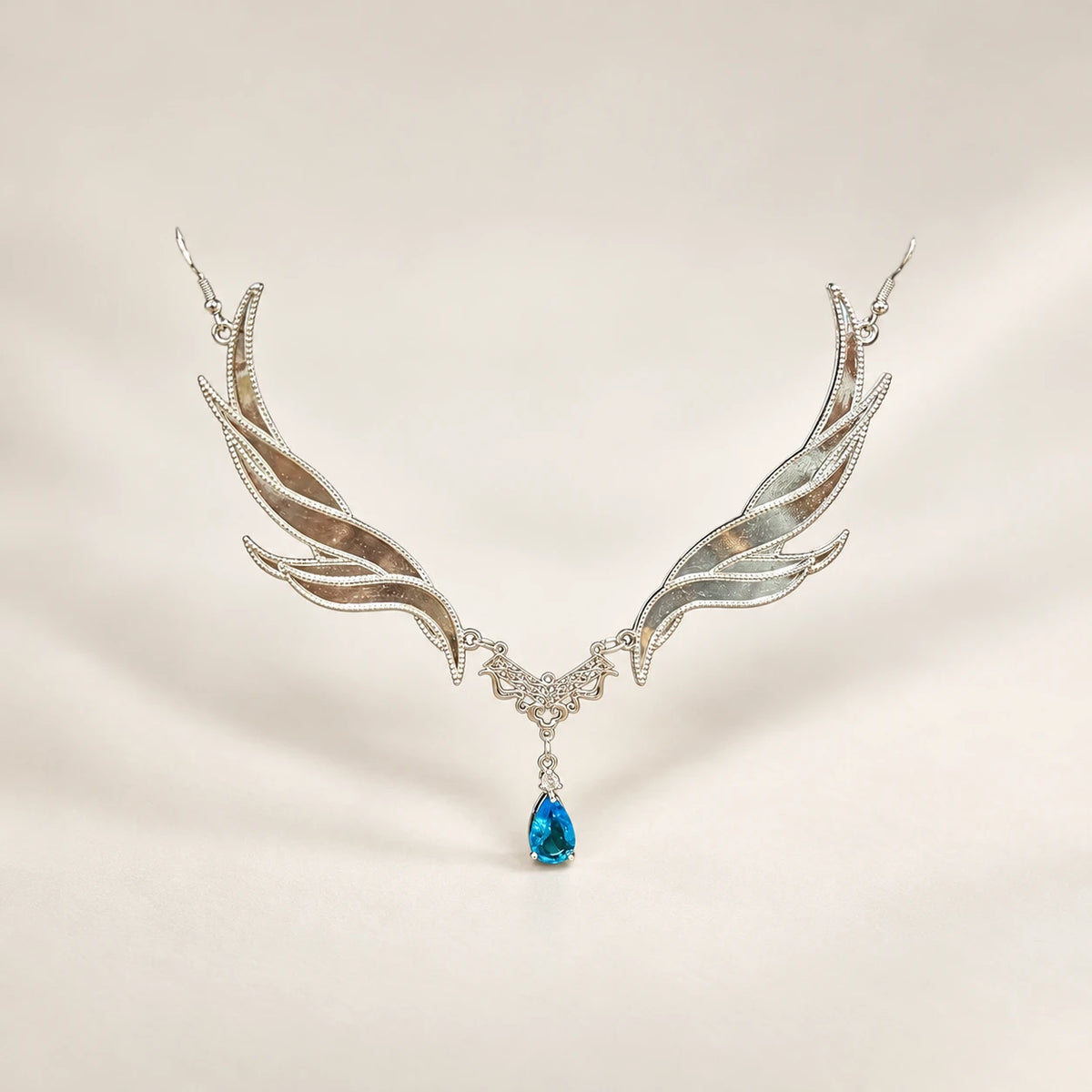Blue-accent forehead ornament with wing-shaped sides