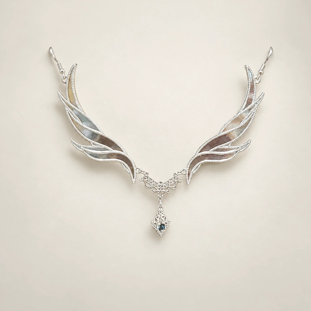 Clear-accent forehead ornament with wing-shaped sides