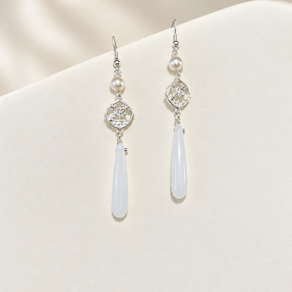 Matching silver-tone drop earrings