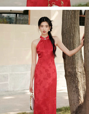 Additional styling view of the Dusk Red mulberry silk halter qipao dress, showing the garment's shape, texture and finish.