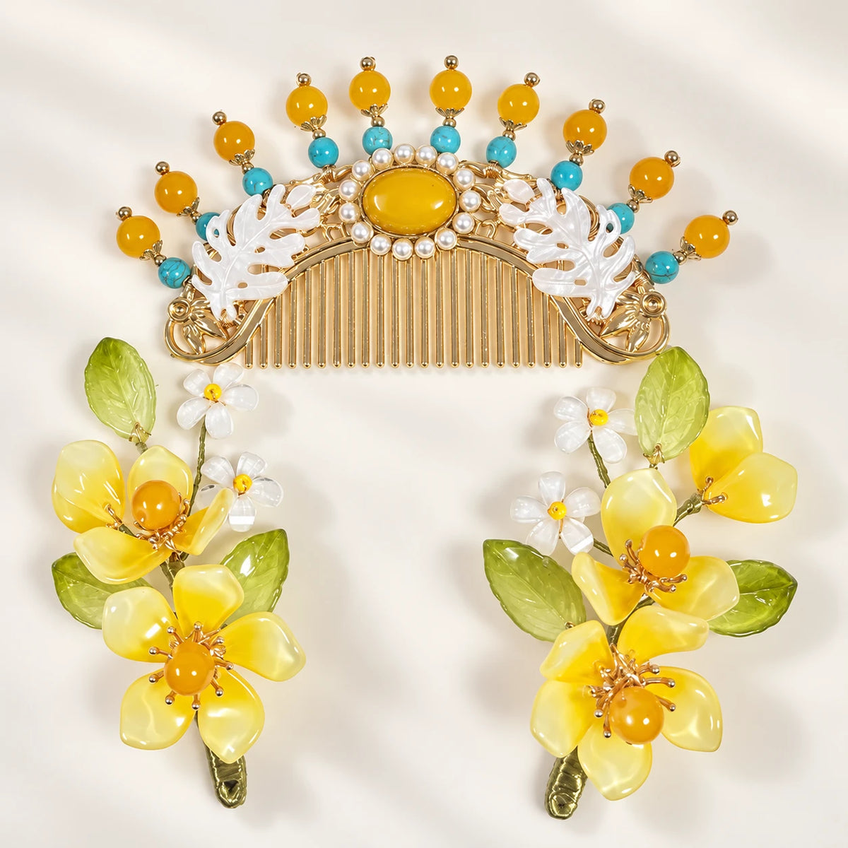 Yellow floral clips beside the matching comb