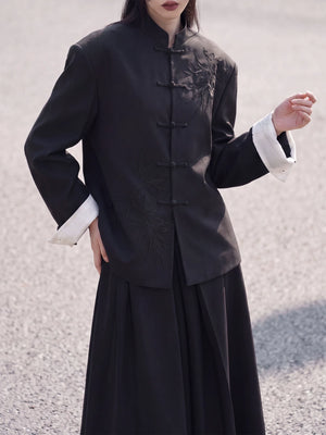 Front view of the black bamboo blazer with frog closures