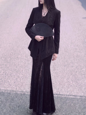 Front view of the black belted jacket with wide lapels