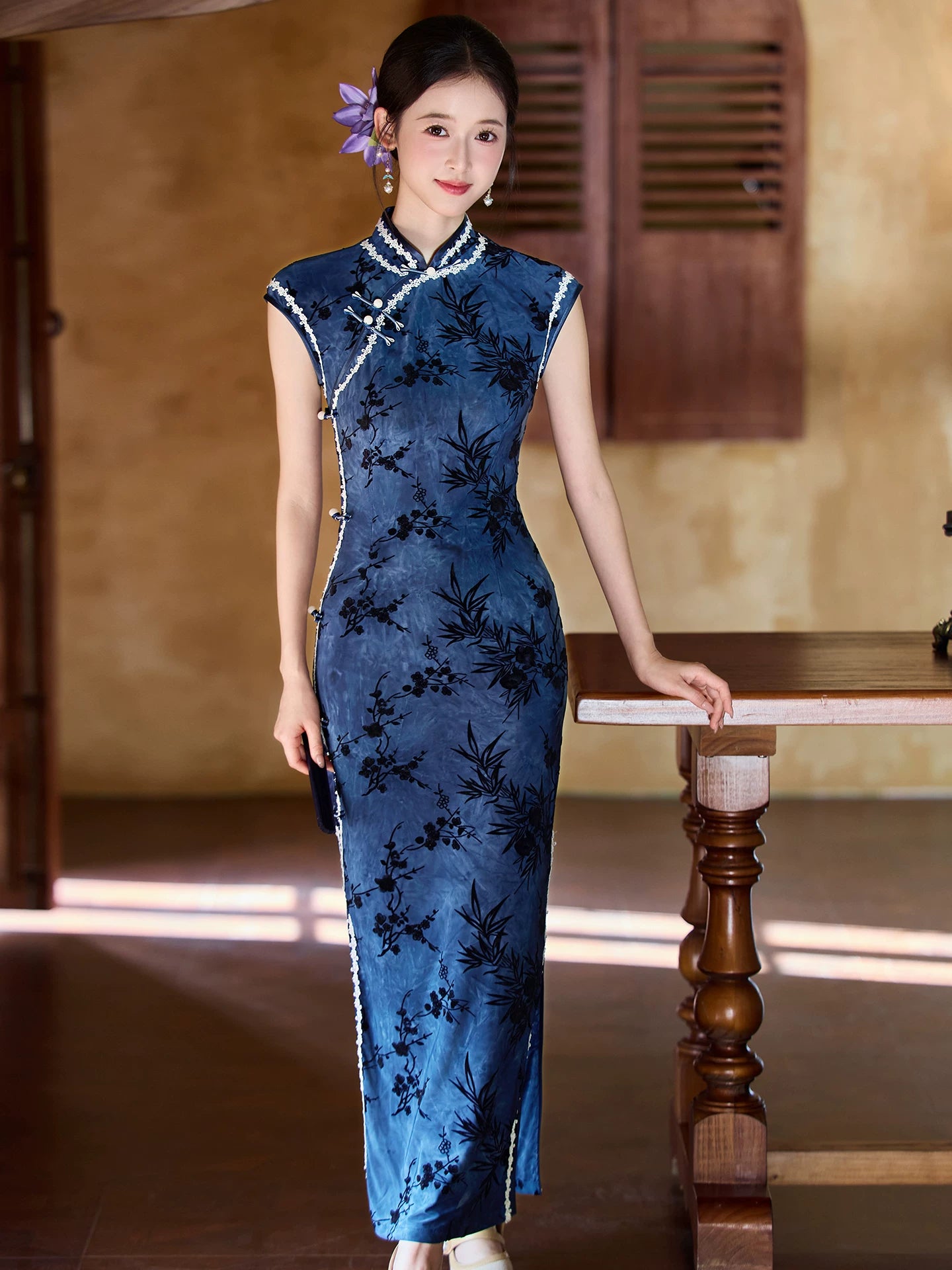 Full-length front view of the blue bamboo qipao with a fitted silhouette and side slit